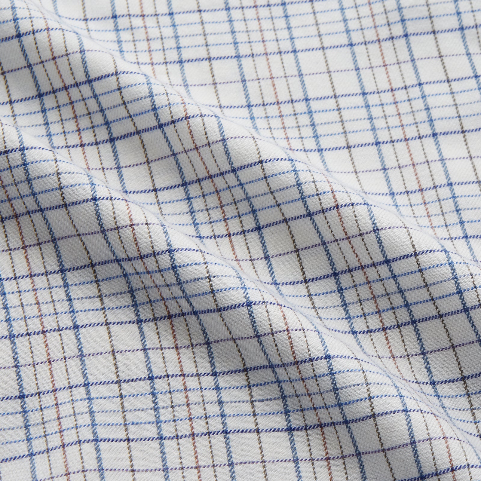View 2 of product The Turnbull & Asser Blue Multi Check Cotton-Cashmere Modern Pyjama Set features a two-piece design with a long-sleeve button-up top with breast pocket and matching elastic-waist pants in a blue and white check pattern.