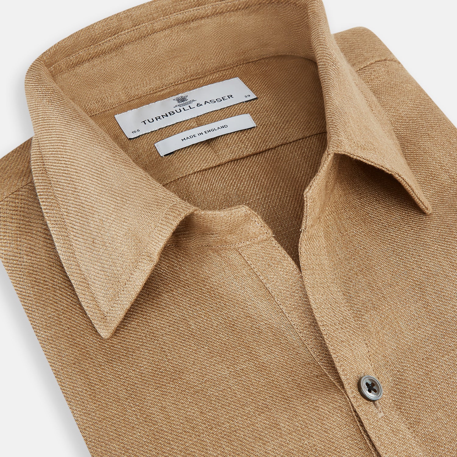 View 2 of product The Turnbull & Asser Camel Linen Windsor Shirt features long sleeves, a tailored fit, and classic collar in light brown camel linen, shown against a white background.
