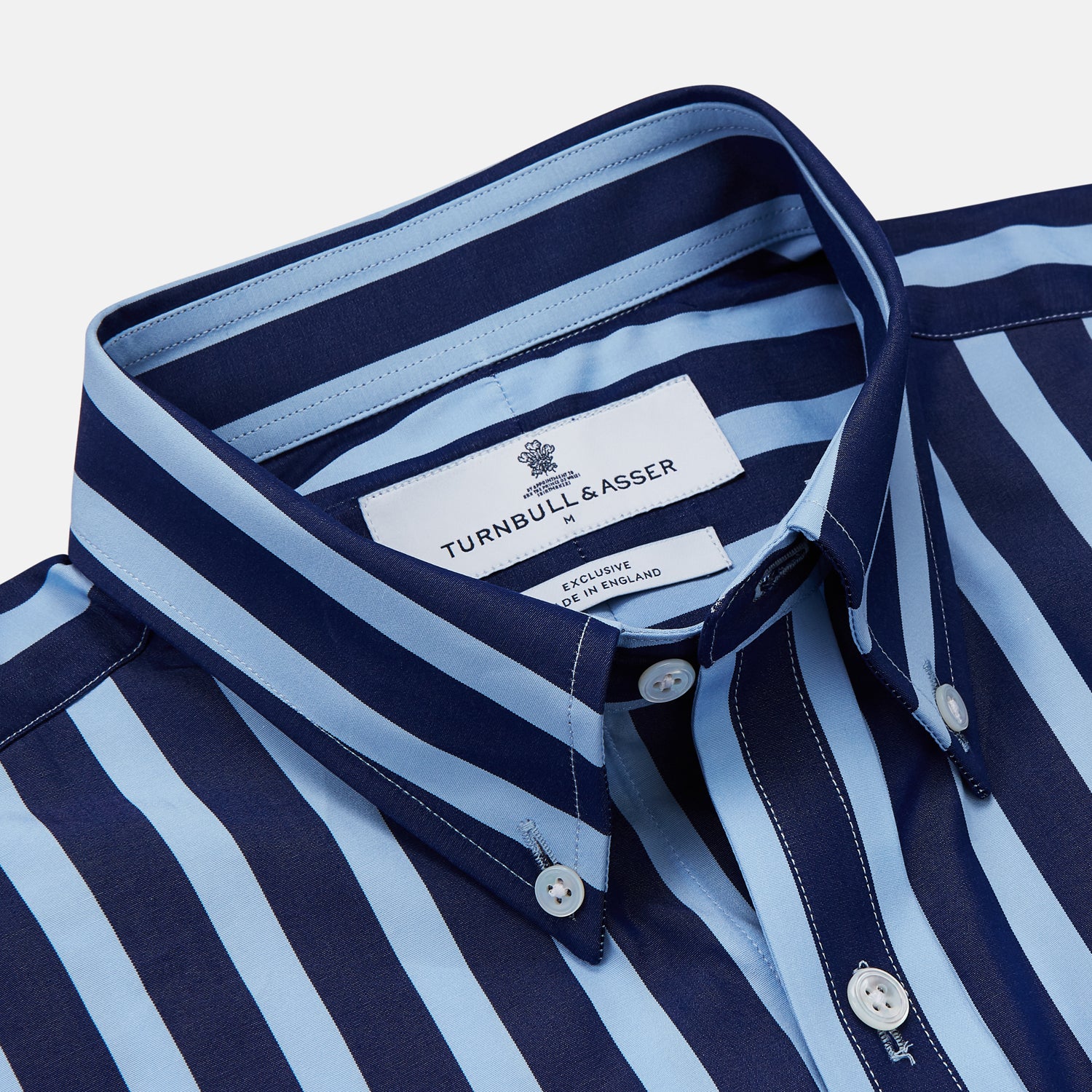 View 3 of product The Turnbull & Asser Navy Multi Stripe Cotton Weekend Fit Suffolk Shirt features vertical blue and navy stripes, a chest pocket, buttoned cuffs, and a classic buttoned Dorset collar.