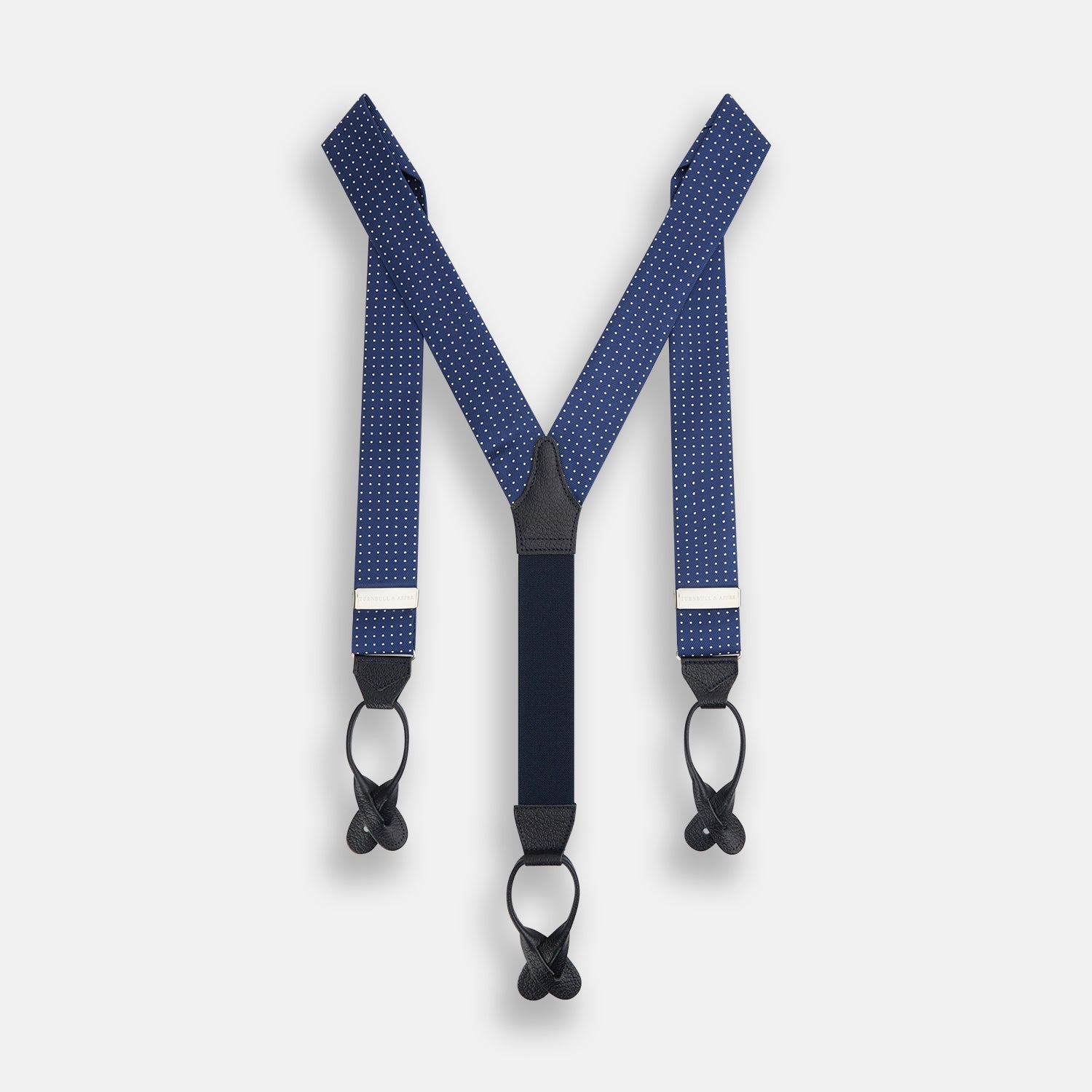 View 2 of product Turnbull & Asser Navy & White Small Spot Adjustable Silk and Navy Leather Braces feature silver-engraved clips and leather button loops—perfect for refined sartorial style.