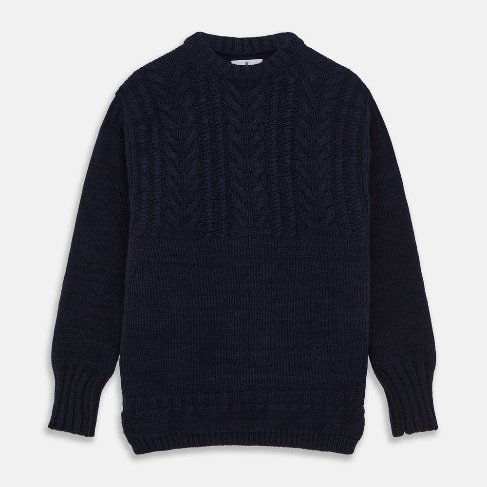 The Turnbull & Asser Navy Wool and Cotton Blend Albany Guernsey Jumper, shown flat on a white background, features long sleeves, a classic cable knit pattern on the upper half, and ribbed cuffs, hem, and collar.