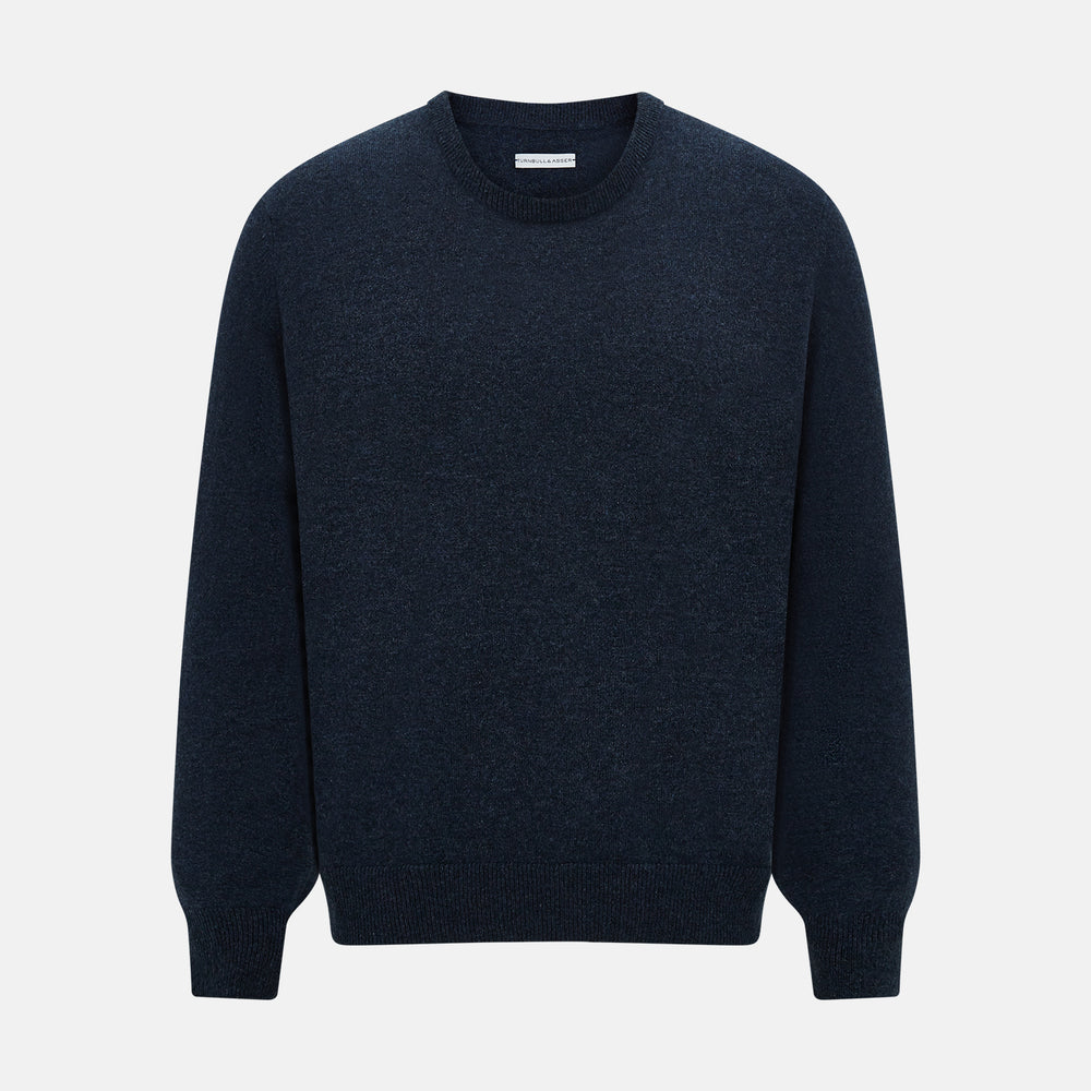 The Turnbull & Asser Midnight Blue Cashmere Round Neck Jumper, featuring long sleeves and ribbed trims, is shown against a light grey background.