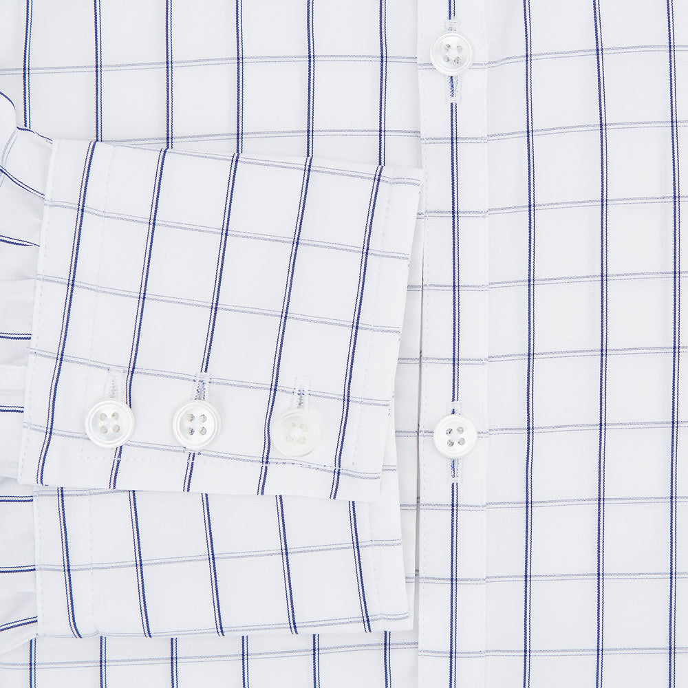 A Dark Navy Double-Line Checked Westminster Shirt by Turnbull & Asser, featuring button-down front, pointed collar, and buttoned cuffs—displaying British craftsmanship—laid flat on a white background.