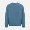 View 3 of product The Turnbull & Asser Pale Blue Fine Merino V-Neck Cardigan features long sleeves and five black buttons, showcased on a plain white background.