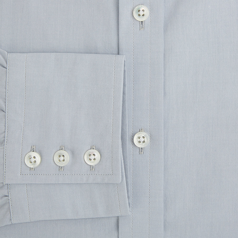 The Dove Grey Mayfair Shirt by Turnbull & Asser is a long-sleeve button-up with a collar, front pocket, and white buttons, crafted from soft sanforised cotton and laid flat on a white background.