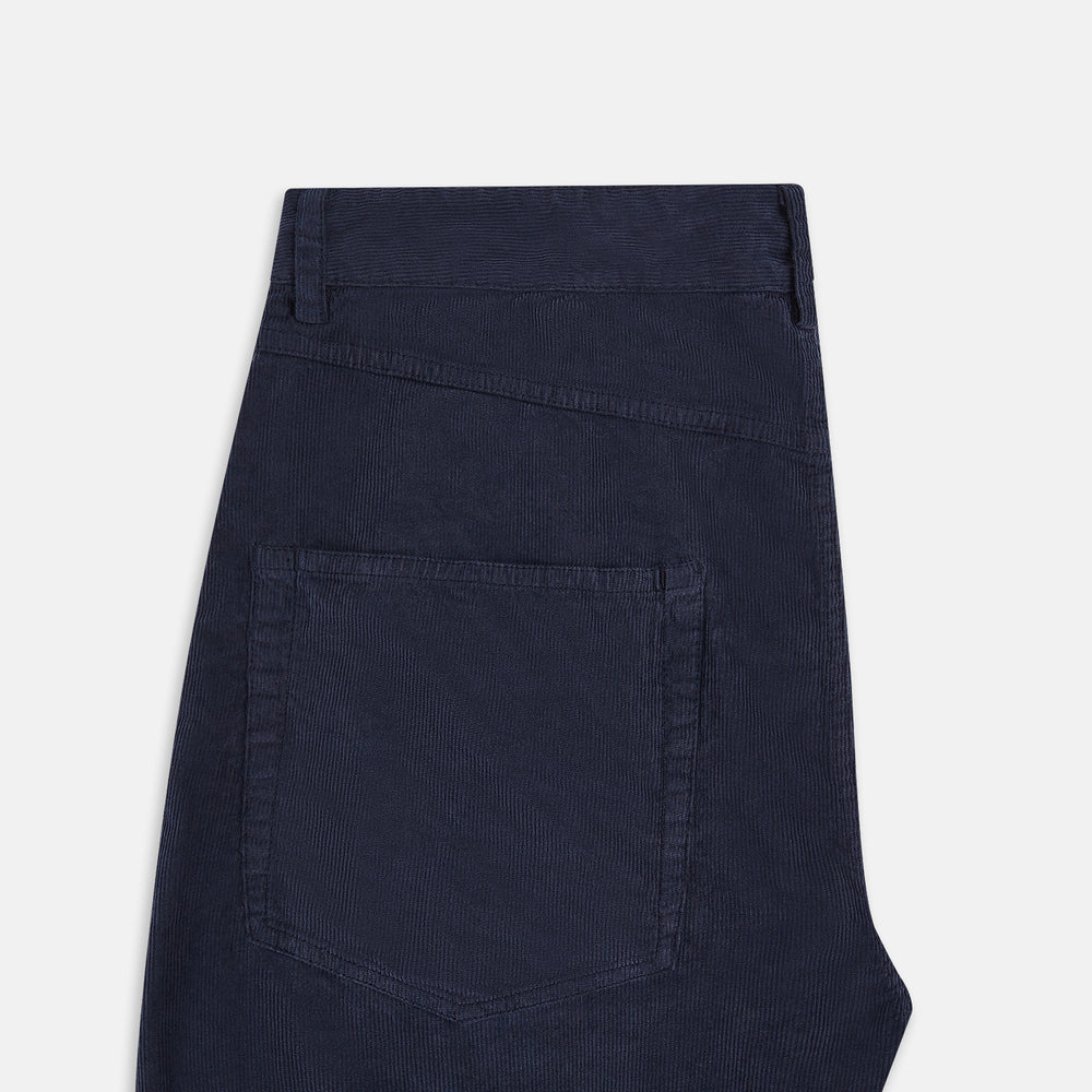 The Turnbull & Asser Light Navy Corduroy Charles Trousers feature a straight-leg fit, stretch cotton, belt loops, front pockets, and a button-zip closure—highlighting British tailoring against a white background.