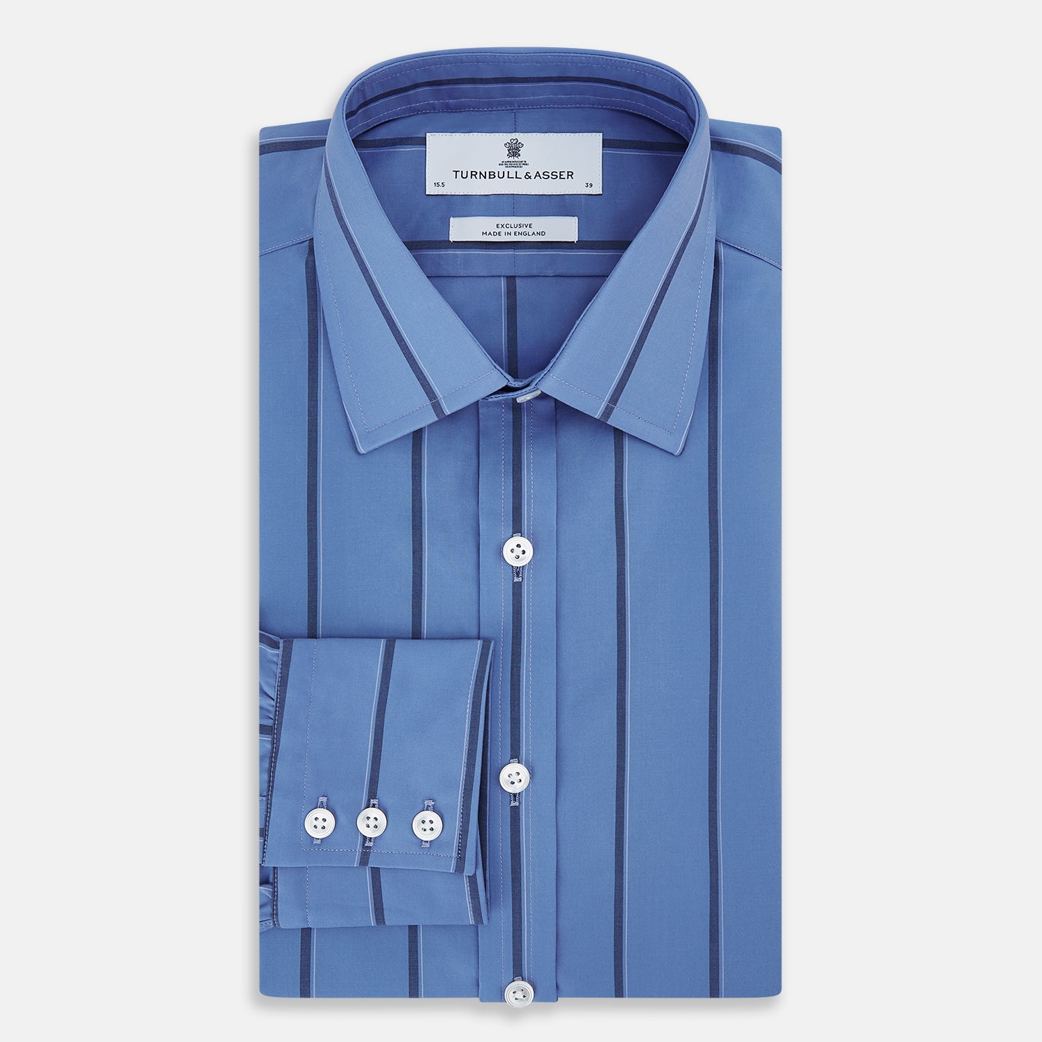 View 5 of product The Turnbull & Asser Colony Blue Track Stripe Mayfair Shirt is crafted from Italian cotton with long sleeves, dark blue track stripes, a classic collar, and buttoned cuffs, shown against a white background.