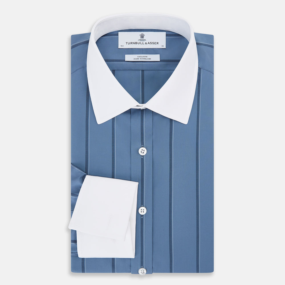 The Turnbull & Asser Steel Grey Track Stripe Shirt features vertical black stripes, a contrast white T&A collar, and white cuffs, shown against a plain light background.