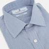 View 2 of product The Turnbull & Asser Pale Blue Micro Graph Check Mayfair Shirt features a small blue and white check pattern, classic T&A collar, white buttons, and buttoned cuffs. Presented on a plain white background.