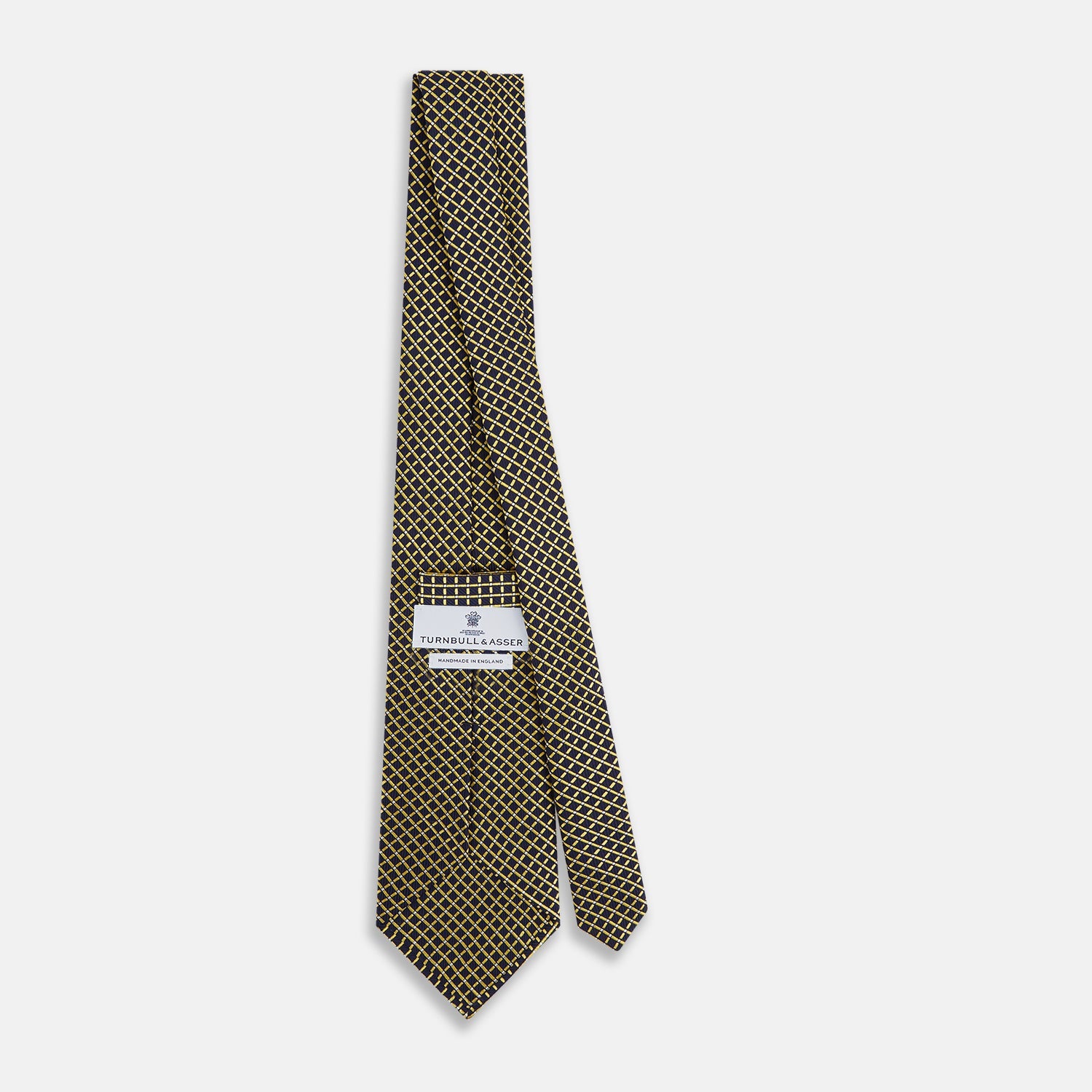 View 4 of product The Turnbull & Asser Yellow and Navy Diamond Silk Tie, with a refined yellow and light blue grid pattern, is elegantly rolled up on a plain white background.