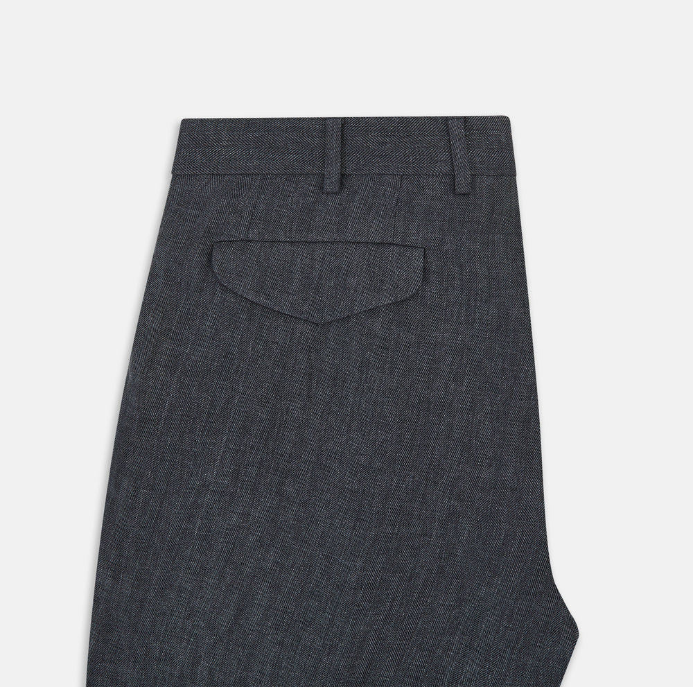 The Ash Linen Herringbone Edmund Trousers by Turnbull & Asser feature a straight-leg fit, button closure, belt loops, and side pockets in summer-ready fabric—ideal for utility dressing—shown against a plain white background.