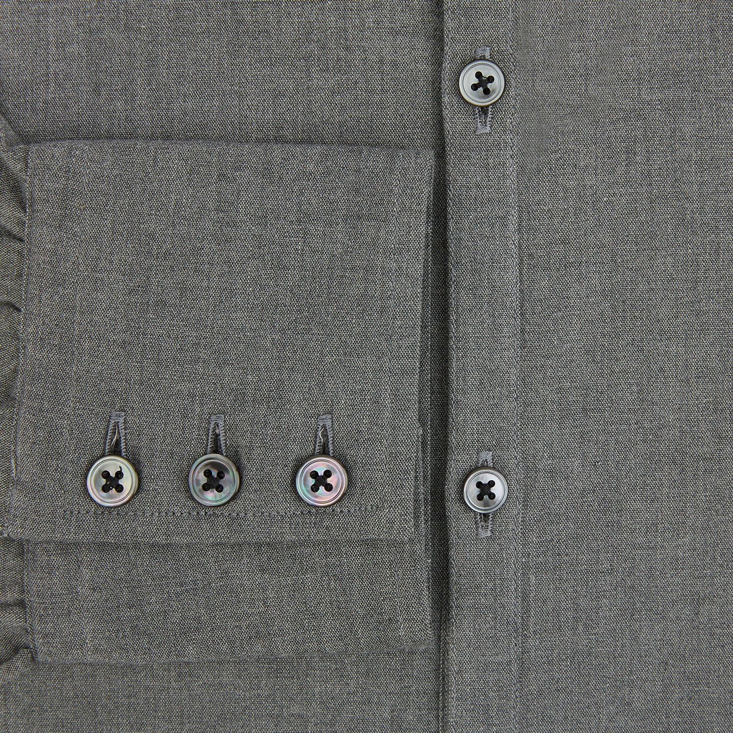 View 4 of product The Pale Charcoal Westminster Shirt by Turnbull & Asser features British craftsmanship with a tailored silhouette, long sleeves, pointed collar, buttoned cuffs, and a solid pale charcoal hue, elegantly shown against a white background.