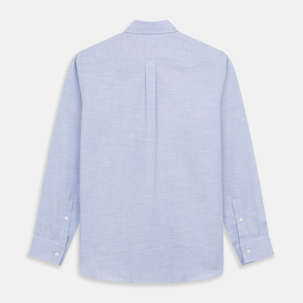 The Turnbull & Asser Pale Blue Weekend Fit Hayne Shirt features a Dorset collar, white buttons, and 1-button cuffs. This casual, long-sleeve button-down is displayed laid flat on a white background.