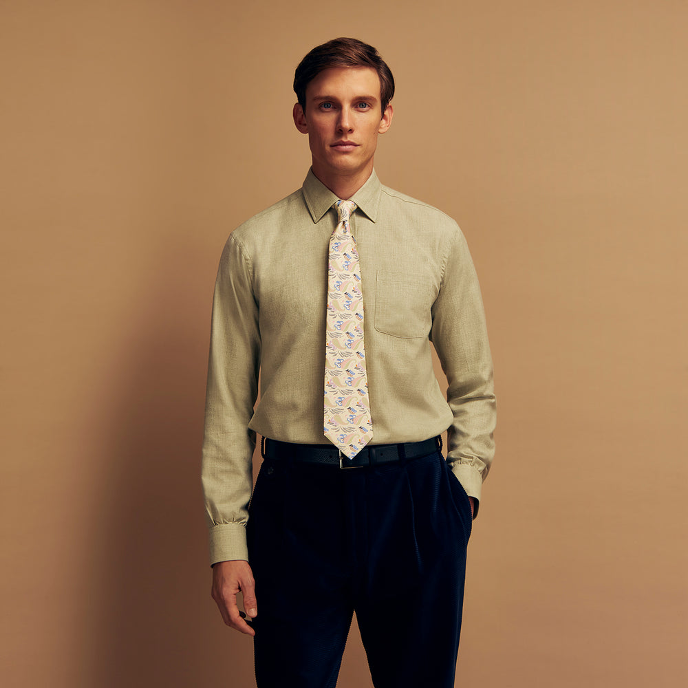 The Turnbull & Asser Soft Green Cashmerello Weekend Fit Finch Shirt features a Derby collar, long sleeves, chest pocket, white buttons, and cuffs. Laid flat on a white background.