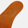 View 3 of product Turnbull & Asser’s Orange Patterned Mid-Length Socks, made from soft Egyptian cotton and featuring a ribbed cuff with small black and yellow geometric dots, are displayed against a plain white background.