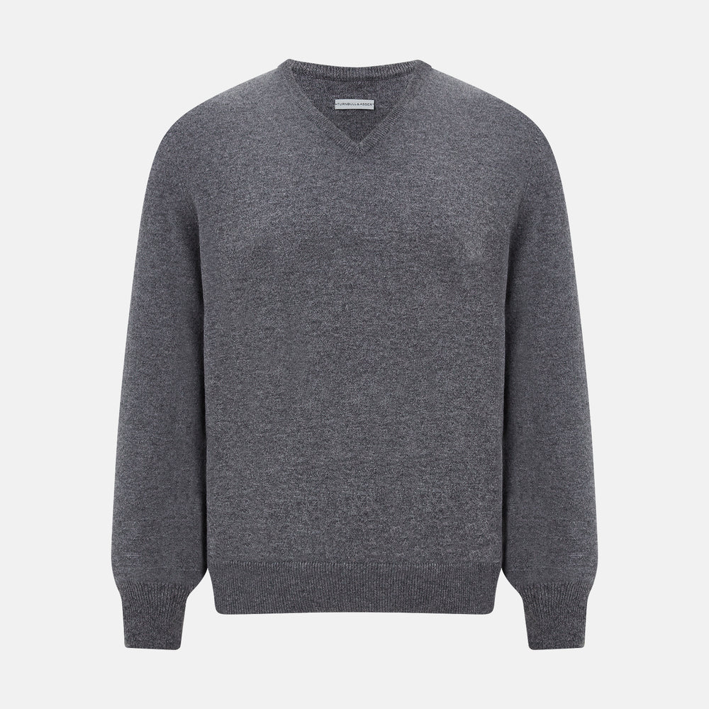 The Turnbull & Asser Storm Grey Cashmere V-neck Jumper features long sleeves, ribbed cuffs and hem—versatile knitwear shown on a white backdrop.