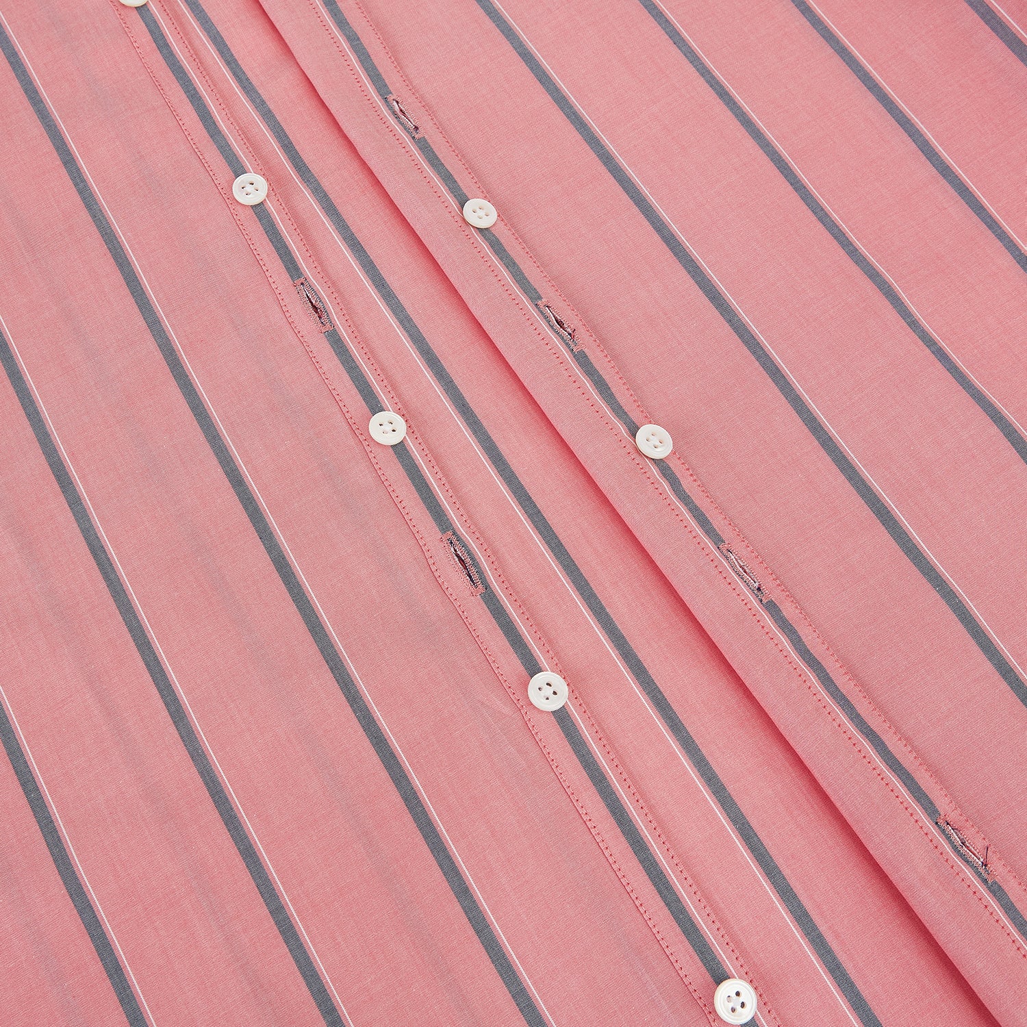 View 7 of product The Coral Pink Track Stripe Westminster Shirt by Turnbull & Asser features vertical navy and white stripes, a tailored fit, pointed collar, and buttoned cuffs—is displayed laid flat on a white background.