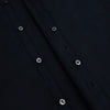 View 7 of product The DARK NAVY WINDSOR SHIRT by Turnbull & Asser is a long-sleeve shirt with a refined Windsor collar, showcasing classic British craftsmanship.