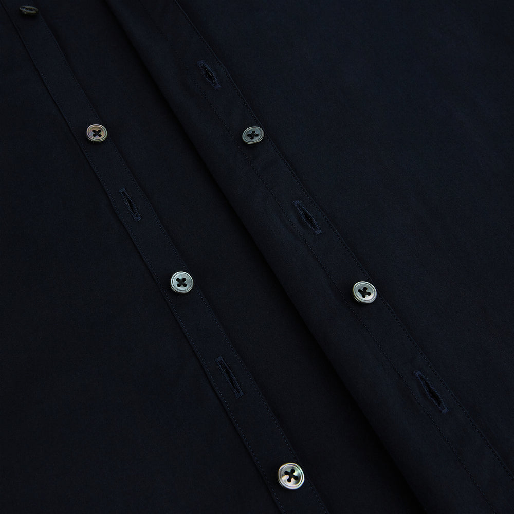 The DARK NAVY WINDSOR SHIRT by Turnbull & Asser is a long-sleeve shirt with a refined Windsor collar, showcasing classic British craftsmanship.