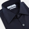 View 2 of product The Navy Westminster Shirt by Turnbull & Asser is a classic long-sleeve, button-up shirt with a pointed collar and buttoned cuffs, exemplifying British craftsmanship, shown against a plain white background.