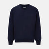 View 6 of product The Turnbull & Asser Navy Fine Merino V-Neck Jumper is displayed against a white background, featuring ribbed cuffs and hem for timeless style in a classic, plain long-sleeve design.