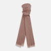 View 1 of product The Dusty Pink Cashmere by Turnbull & Asser is a long, lightweight scarf in muted mauve with frayed edges, hand-dyed and loosely folded—a luxury accessory shown on a plain white background.