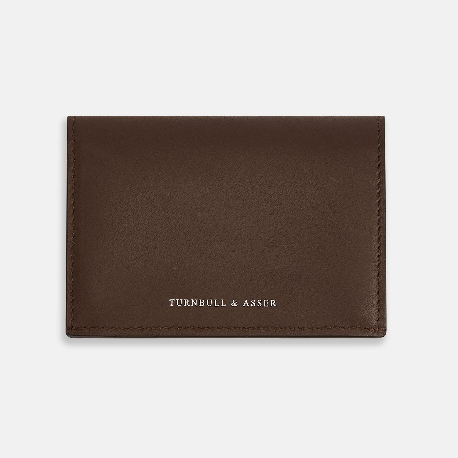 Image 1 of product The Dark Brown Leather Bi-Fold Card Holder by Turnbull & Asser features neat edge stitching and the brand's name embossed in white on the front.