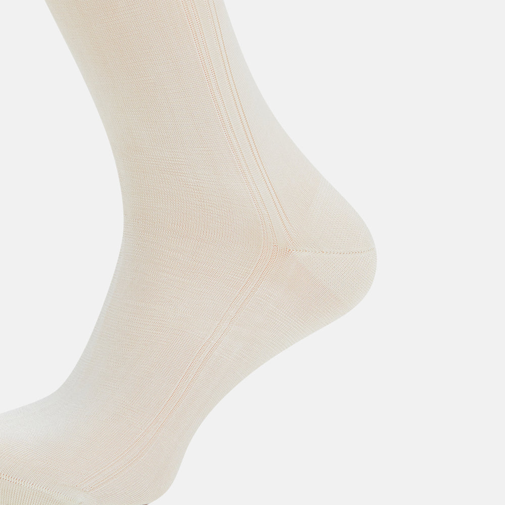 A single Turnbull & Asser Vanilla Silk Long Sock, knee-high and displayed upright, on a plain white background.