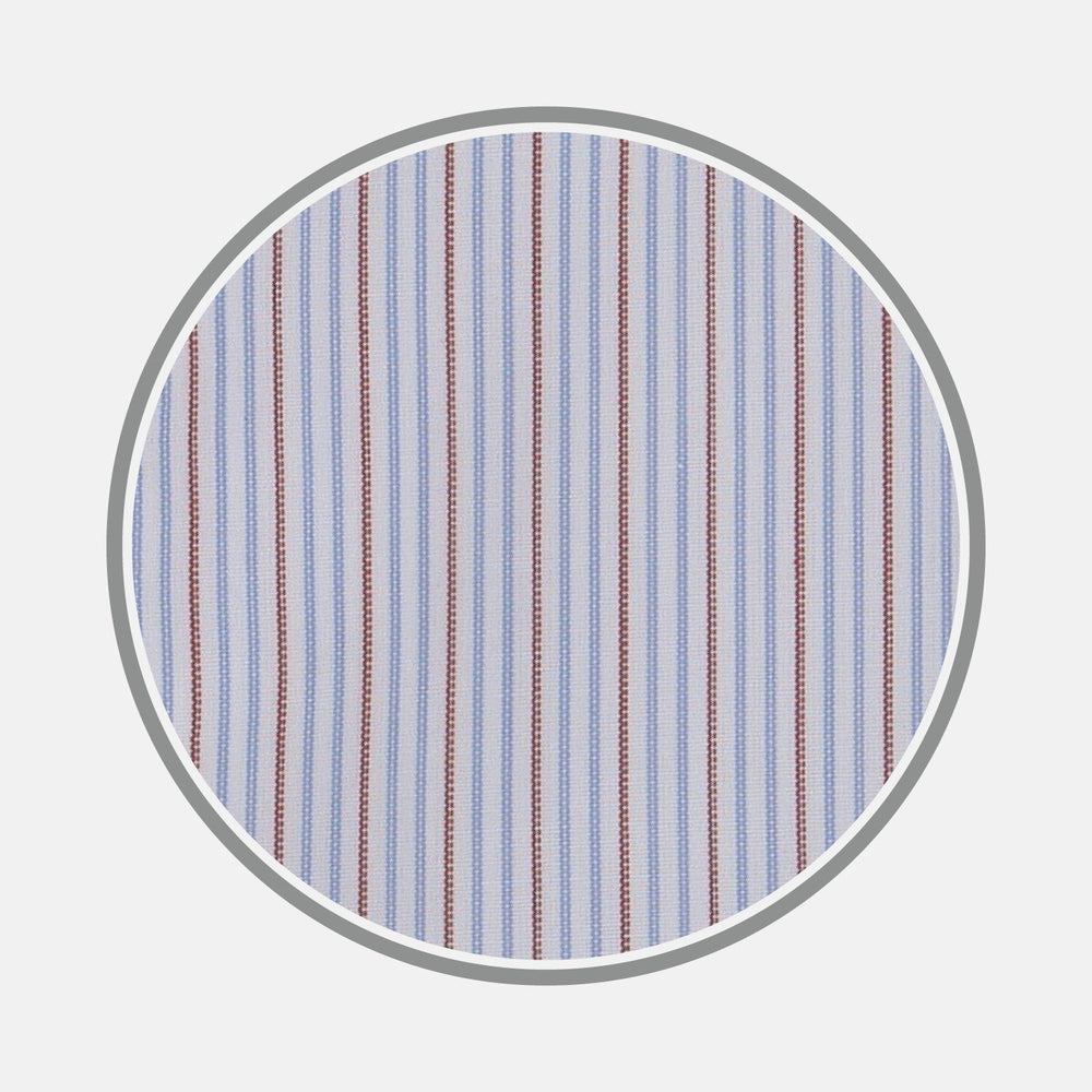 A close-up of Turnbull & Asser’s BESPOKE FABRIC 1058 34 shows blue, white, and red vertical stripes—perfect for a custom shirt—displayed in a circular frame on a light gray background.