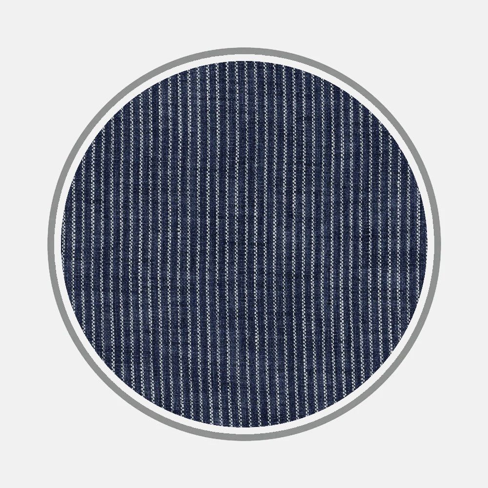 Close-up of Bespoke Fabric 1062 05 by Turnbull & Asser: a circular navy swatch with thin white vertical stripes and a gray border—perfect for custom shirts or elegant monogram designs.