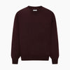 View 5 of product The Turnbull & Asser Burgundy Fine Merino V-Neck Jumper features a classic plain knit design with long sleeves, showcased against a crisp white background.