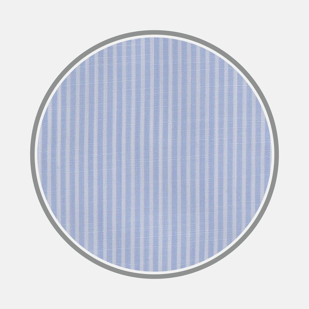A circular swatch of Turnbull & Asser's BESPOKE FABRIC 1095 07 shows light blue and white vertical stripes against a light grey background, with evenly spaced lines ideal for classic bespoke shirts.