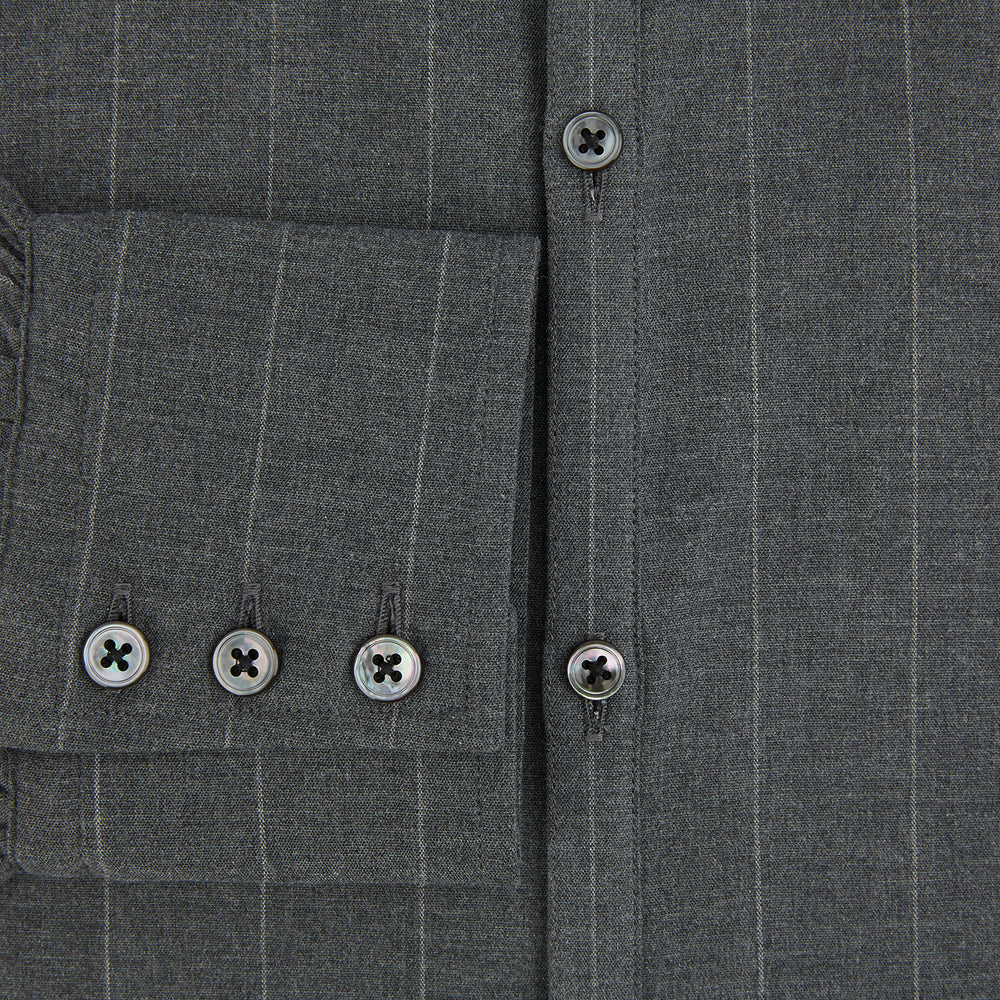 The Charcoal Melange Wide Stripe Westminster Shirt from Turnbull & Asser features long sleeves, a tailored fit, pointed collar, buttoned cuffs, and subtle wide stripes, shown laid flat on a white background.