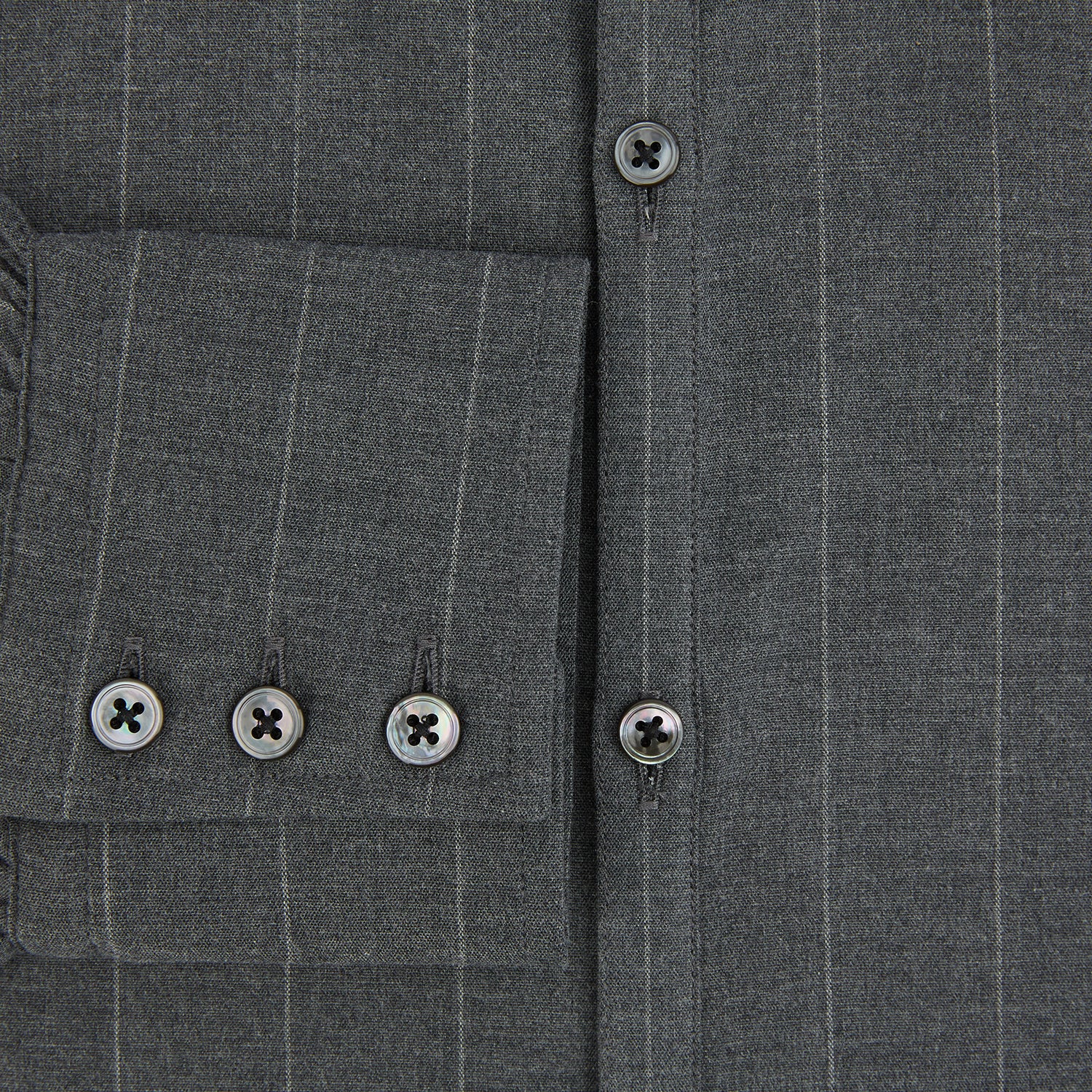 View 4 of product The Charcoal Melange Wide Stripe Westminster Shirt from Turnbull & Asser features long sleeves, a tailored fit, pointed collar, buttoned cuffs, and subtle wide stripes, shown laid flat on a white background.
