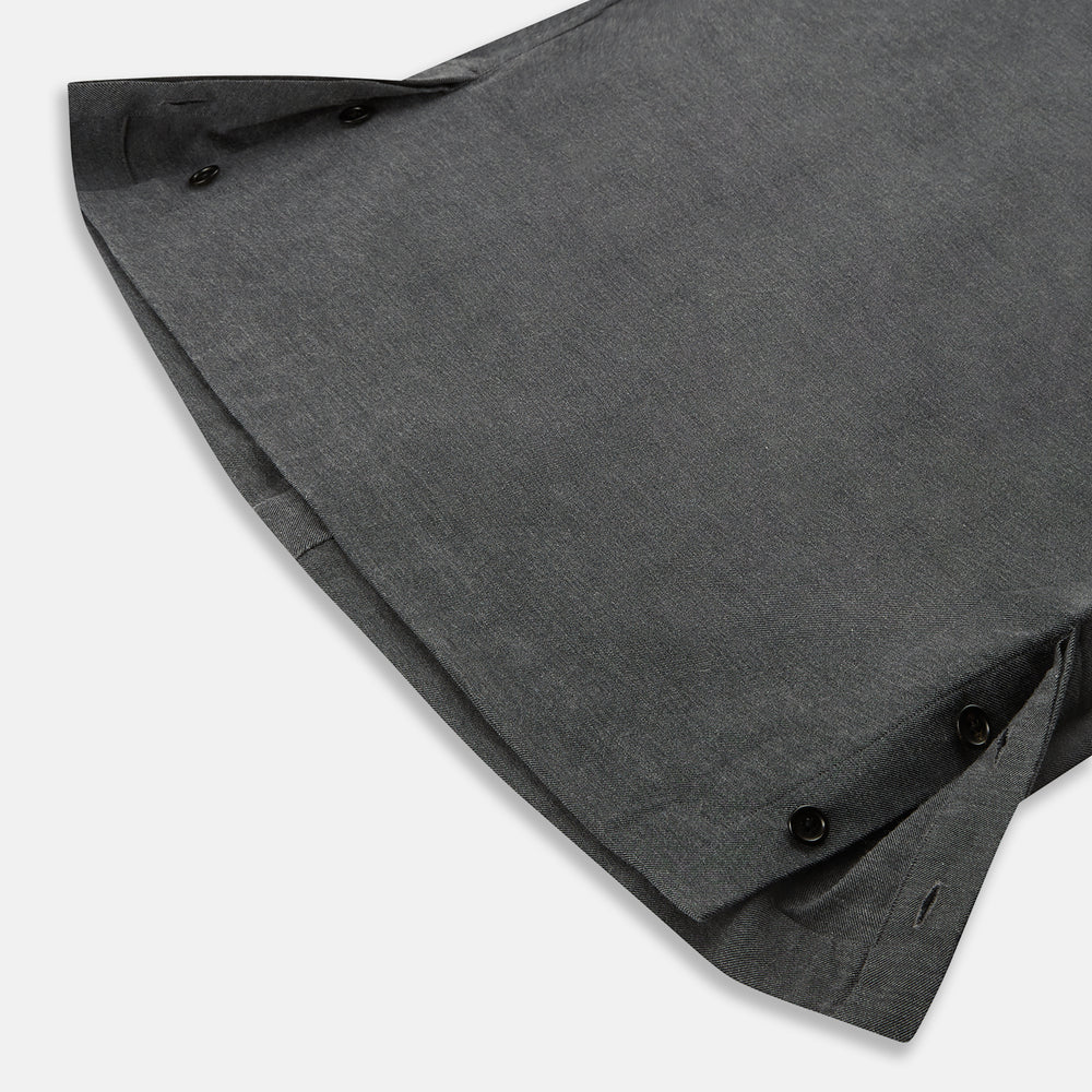 The Charcoal Melange Hampstead overshirt by Turnbull & Asser is a dark gray long-sleeve button-up with a collar, left chest pocket, and two zippered side pockets, shown laid flat on a white background.