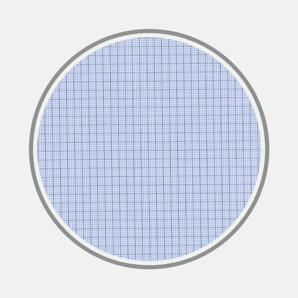 Turnbull & Asser’s Bespoke Fabric 1113 06: a round blue graph paper sheet with a fine grid and gray border, perfect for designing monograms or sketching custom shirt patterns.