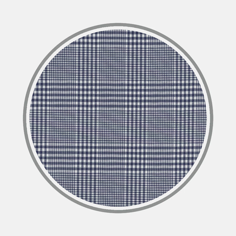 A circular swatch of Turnbull & Asser’s Bespoke Fabric 1114 46 displays a classic navy blue and white plaid with grid lines, bordered in gray on white—perfect for choosing fabric when designing custom shirts.