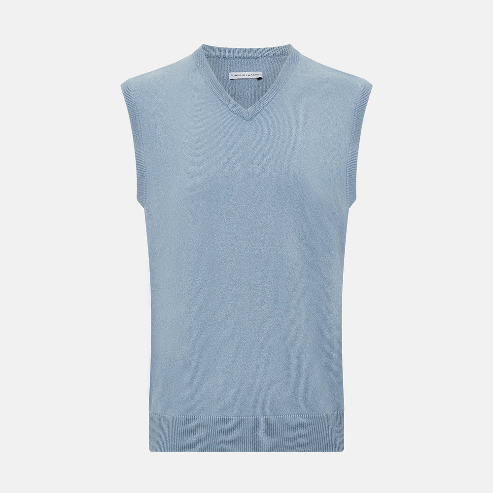 The Frost Blue Cashmere V-neck Vest by Turnbull & Asser features a sleeveless knit design and ribbed edges, shown on a white background—a sophisticated addition to gentleman’s fashion.