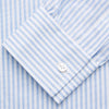 View 4 of product The Turnbull & Asser Pale Blue Stripe Weekend Fit Hayne Shirt features a Dorset collar, 1-button cuffs, and vertical stripes, shown laid flat against a white background.