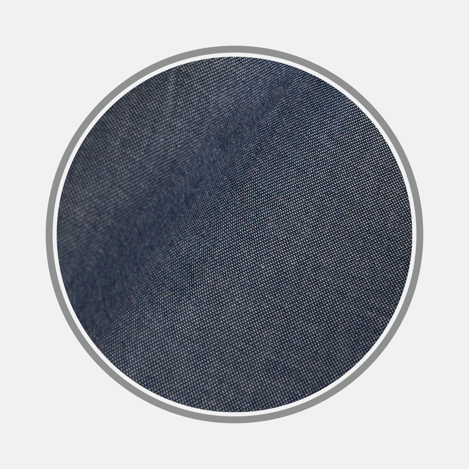 View 1 of product Close-up of BESPOKE FABRIC 1193 06 by Turnbull & Asser, showcasing dark blue denim's textured weave—ideal for bespoke or custom shirts—framed in a circular gray border on a white background.