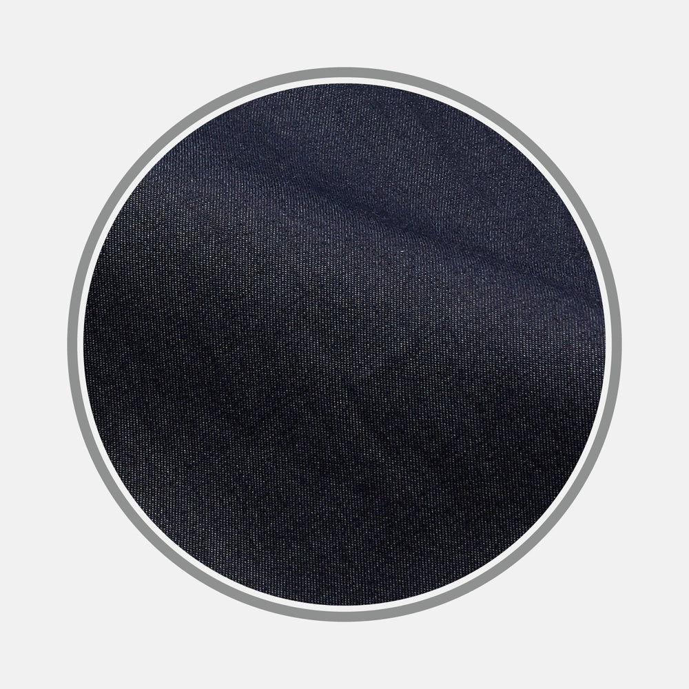 Close-up of BESPOKE FABRIC 1194 06 by Turnbull & Asser: dark blue denim texture shown in a circular frame on light gray—ideal for custom shirts or distinctive monogrammed shirt designs.