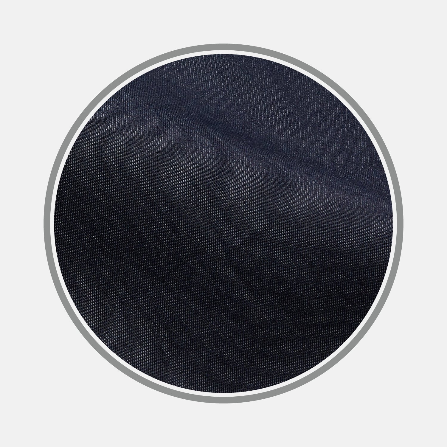View 1 of product Close-up of BESPOKE FABRIC 1194 06 by Turnbull & Asser: dark blue denim texture shown in a circular frame on light gray—ideal for custom shirts or distinctive monogrammed shirt designs.