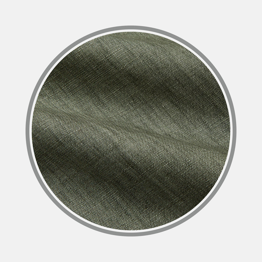 Close-up of Turnbull & Asser’s BESPOKE FABRIC 1246 47 in olive green, featuring a subtle diagonal weave—perfect for a custom shirt—displayed in a circular frame on a white background.