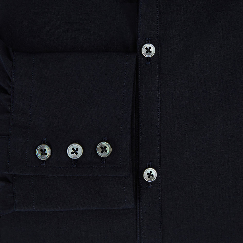 The NAVY BLUE WINDSOR SHIRT by Turnbull & Asser features long sleeves, a classic Windsor collar, white buttons, and buttoned cuffs—highlighting refined British craftsmanship against a plain white background.