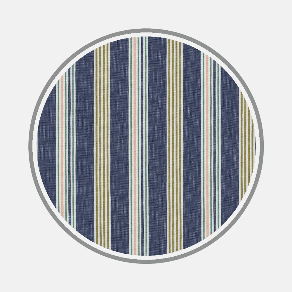 Turnbull & Asser’s Bespoke Fabric 1265 32 is a round rug with vertical stripes in navy, olive green, white, and pale pink on a light gray background—ideal for rooms styled with bespoke shirt fabrics or classic monogram designs.