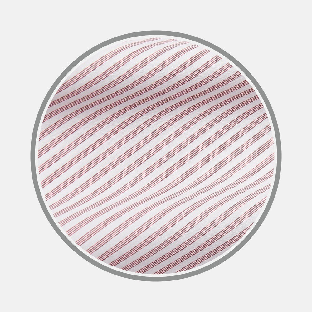 A circular swatch of Turnbull & Asser’s NEW BESPOKE FABRIC 1288 48: white with diagonal red stripes in varying widths and a slim gray border—ideal for dynamic shirt designs or distinctive monogram accents.