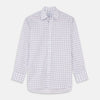 View 2 of product NEW BESPOKE FABRIC 1327 34 by Turnbull & Asser: White fabric with a red and blue plaid design, shown in a circular frame. Perfect for bespoke or custom shirts, the material features intersecting lines forming squares and a slightly wrinkled texture.
