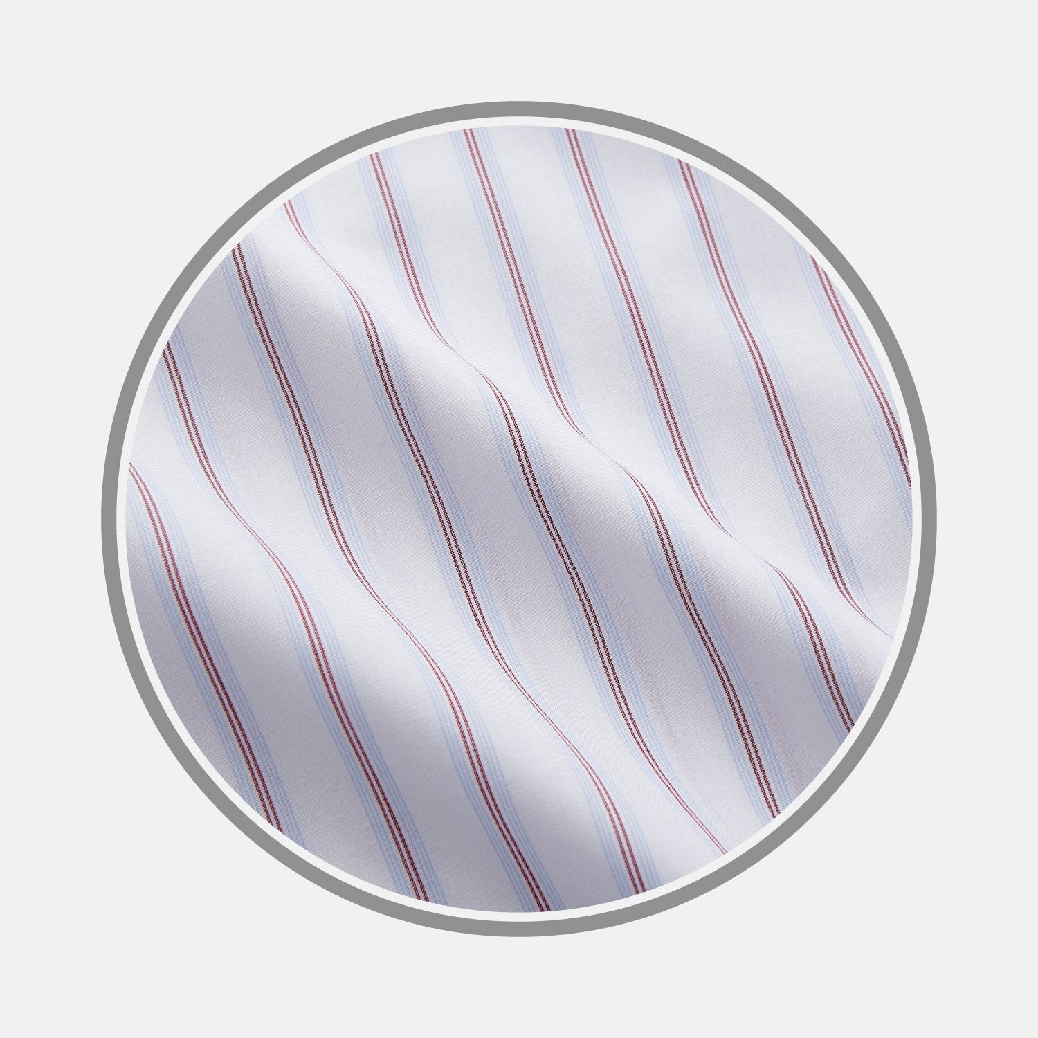 View 1 of product Close-up of NEW BESPOKE FABRIC 1329 34 by Turnbull & Asser: white fabric with vertical blue and red stripes, shown in a circular frame on light gray, highlighting the textured quality of bespoke shirt craftsmanship.