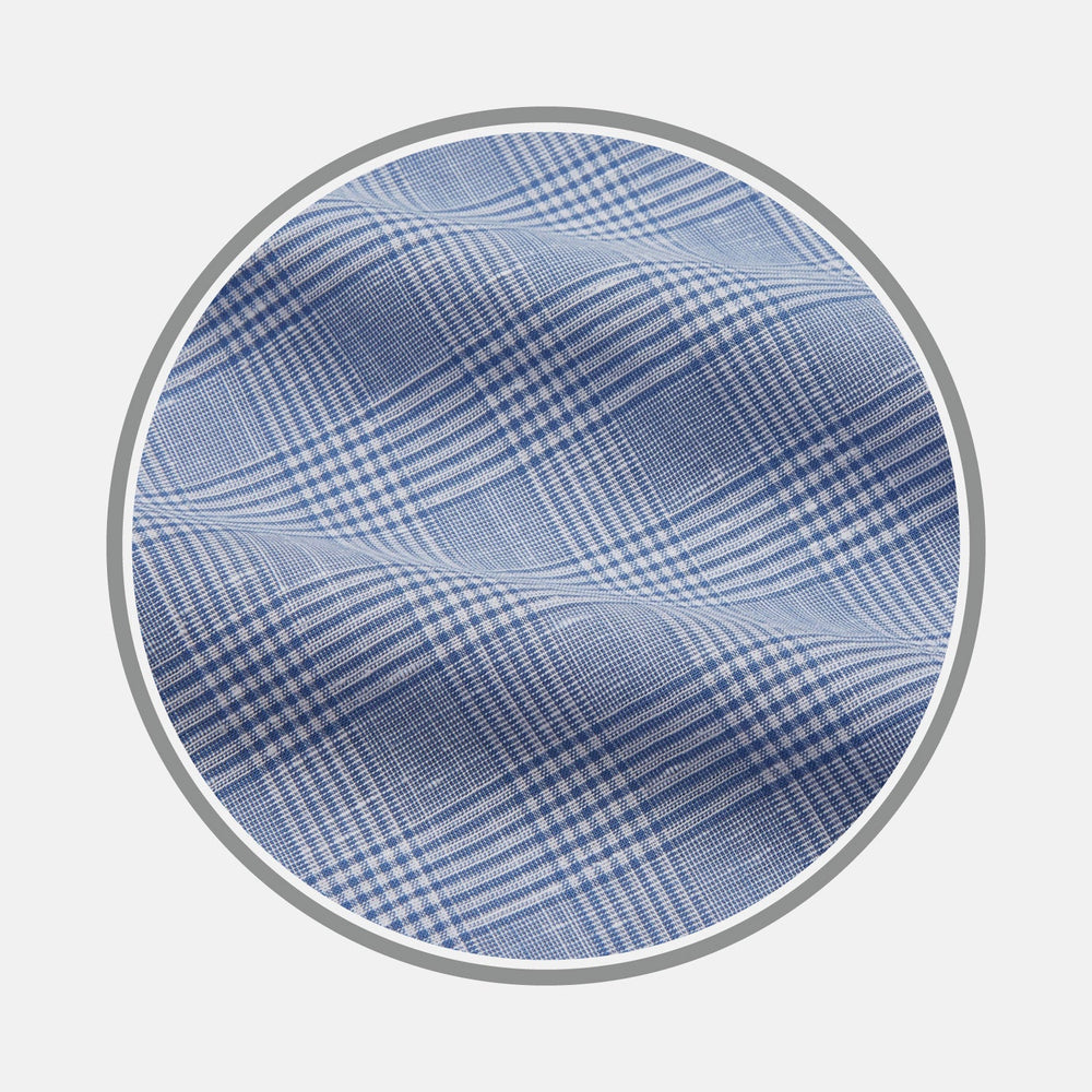 Close-up of BESPOKE FABRIC 1341 07 by Turnbull & Asser: blue and white plaid with a crisscross pattern, displayed in a circular frame on white—perfect for custom shirts or distinctive monogram designs.