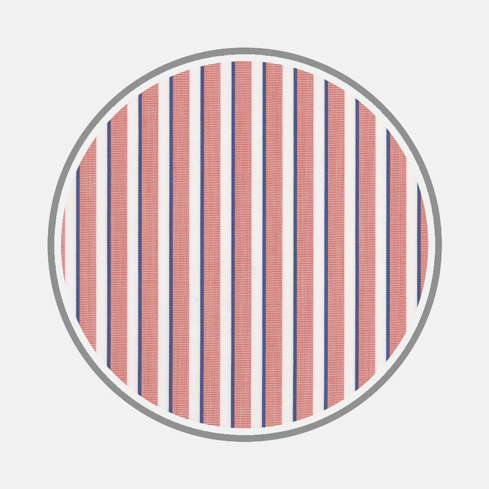 Turnbull & Asser’s Bespoke Fabric 1389 36 features a circular frame with alternating vertical red and blue stripes on white, evoking classic custom shirt monogram designs.